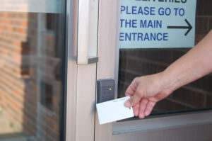 picture showing proximity card in front of door with card access system