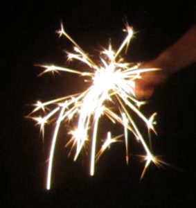 picture of a child's hand holding a sparkler