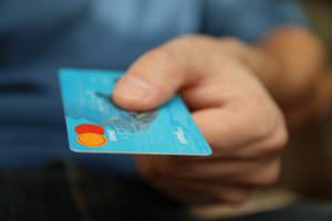 man holding credit card