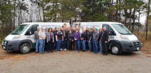Picture of Heartland Security employees in front of Heartland Security vans