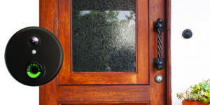 black Skybell doorbell with wood front door