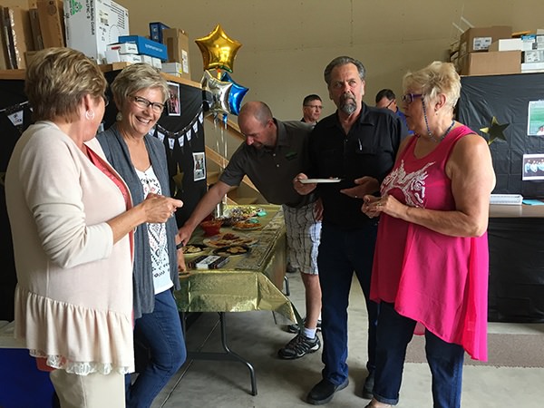 picture of Tom's wife Karen along with Deb, Bill, and Bill's wife Betty share stories