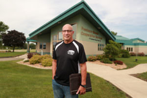 picture of Tom Vega in front of Freeborn Mower Electric Cooperative