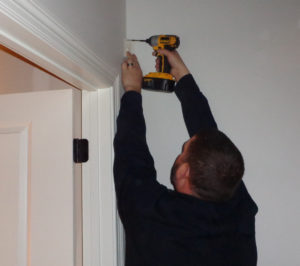 Technician Adam installs a motion detector