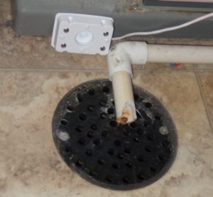 Side-mounted water sensor near floor drain