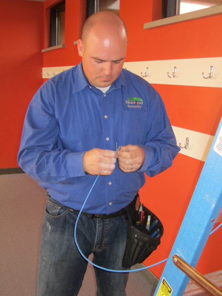 Picture of technician Josh working with the wiring
